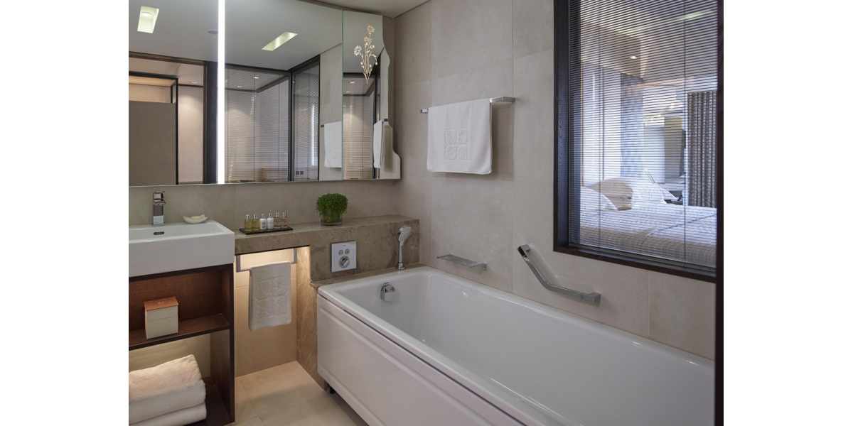 Insulated Glass Blinds and Mirror with Sandblasted Flower Detail located in the Superior Room